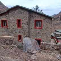 A huge rock nearly destroyed the hut of the Bureau de Controle et Sensibilisation de Refuge du Toubkal few meters above the Toubkal hut